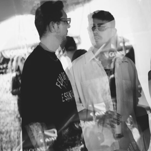 A black and white double exposure of two men
